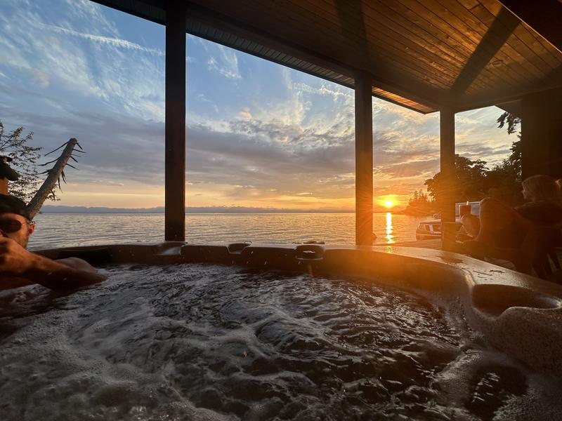 Hottub view overlooking the ocean during a sunset