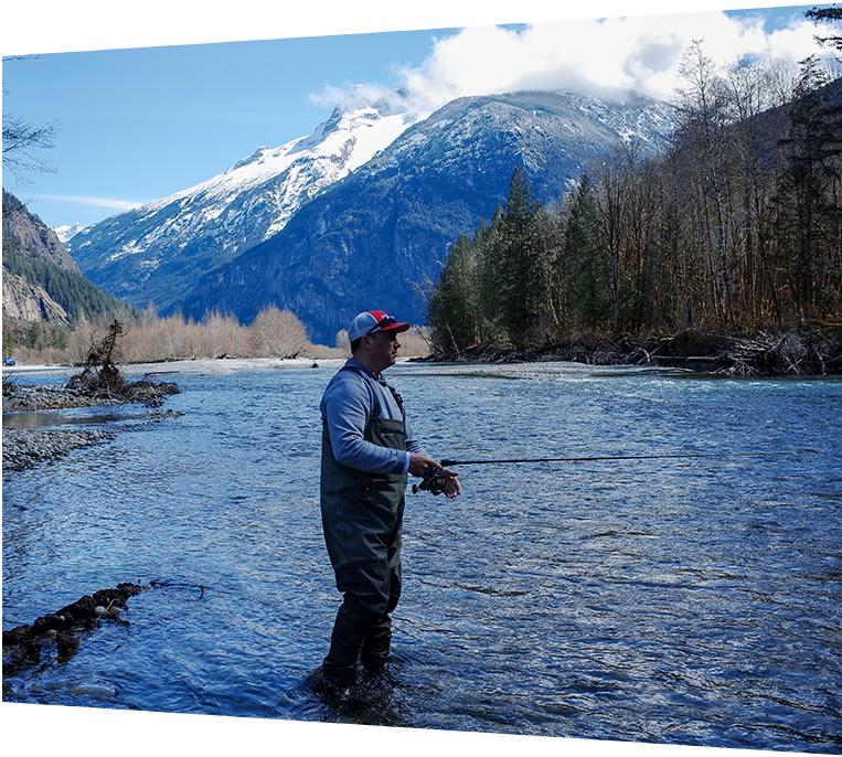 Blue helicopter flying through clear sky